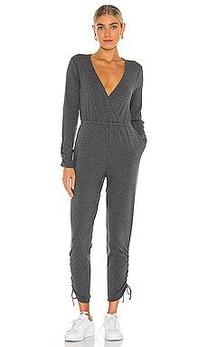 Lovers and Friends Surplice Jumpsuit in Dark Heather Grey from Revolve.com | Revolve Clothing (Global)