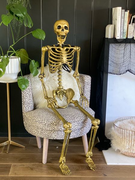 Cozy up a corner of your living room with some spooky vibes ;add a gold skeleton, shearling pillows and plush chair. 

#LTKHalloween #LTKSeasonal #LTKhome