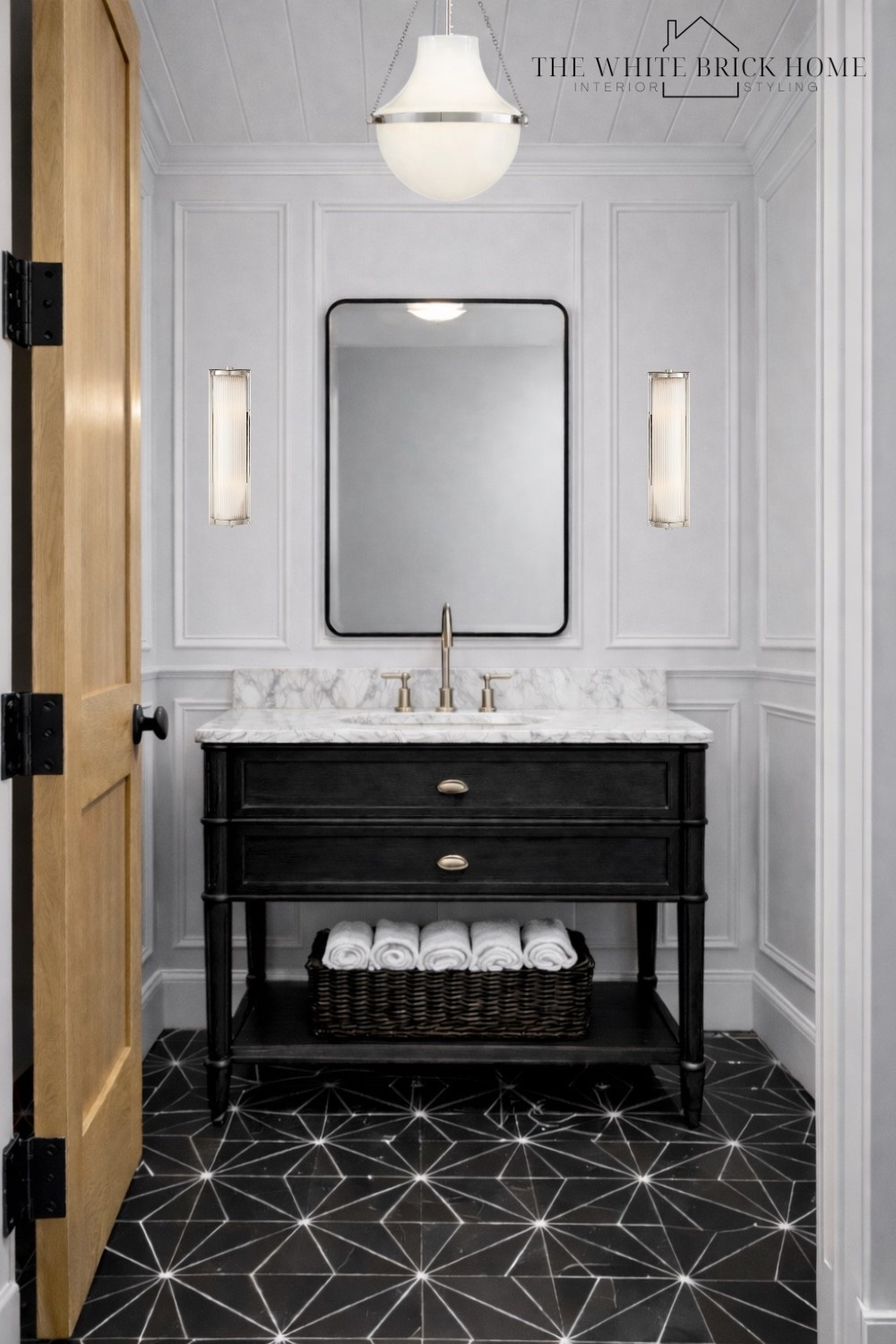 A modern traditional powder bath where crisp picture molding and thoughtful details come together for an elevated look. 

🖤🖤

Bath, bathroom, powder room, bathroom design, bathroom vanity,  bathroom decor ideas, bathroom wall mirror, bathroom lighting, bathroom design. Bathroom wall mirror, bathroom wall sconce, bathroom decor, pottery barn, bedrosians, McGee and co 


#LTKSaleAlert #LTKSeasonal #LTKHome