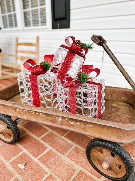Simple and cute front porch decor 🎁 old red wagon filled with presents 

#LTKSeasonal #LTKHoliday #LTKhome