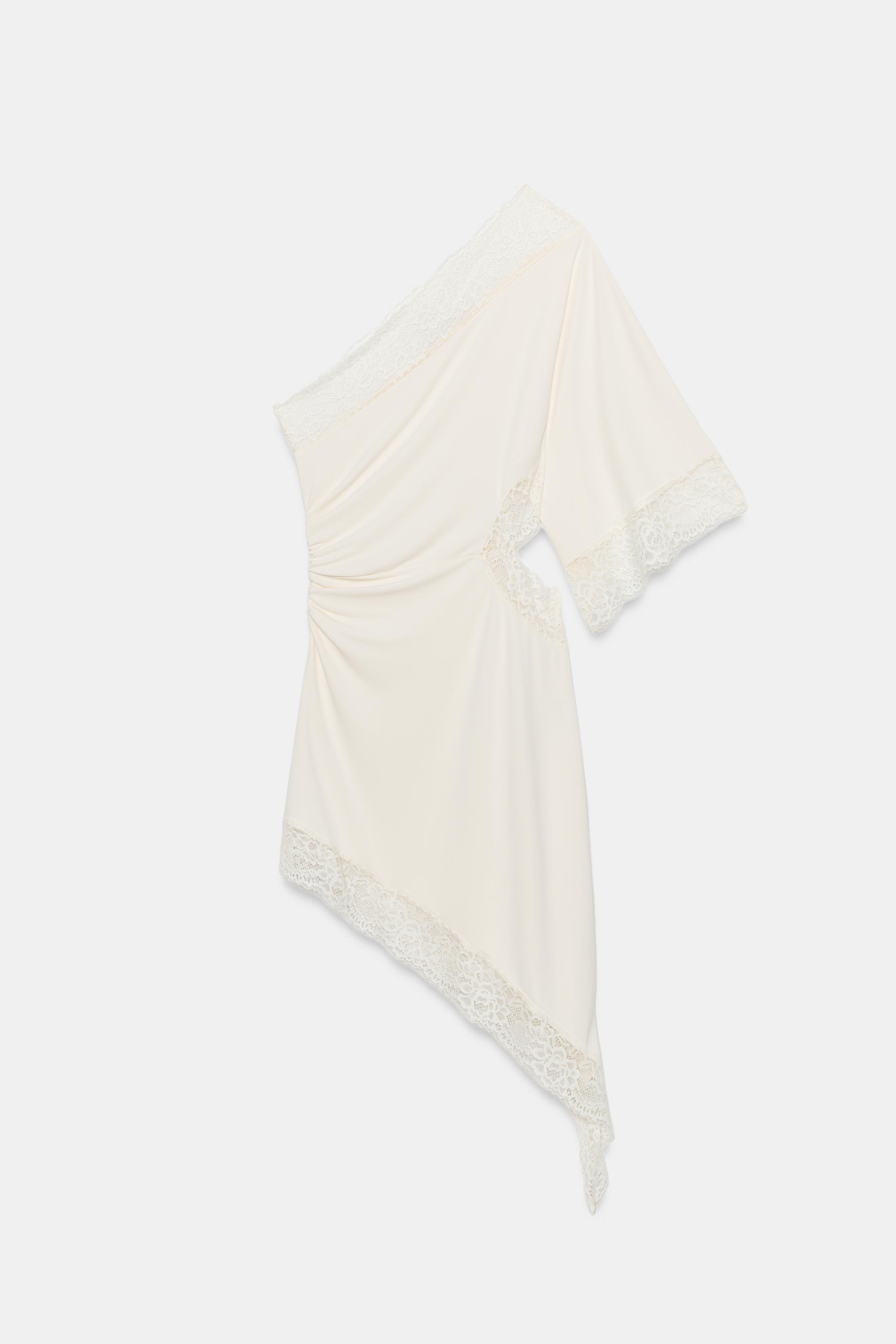 Model height: 180 cmAsymmetric neck dress with below-the-elbow sleeves. Features matching tone la... | Zara US