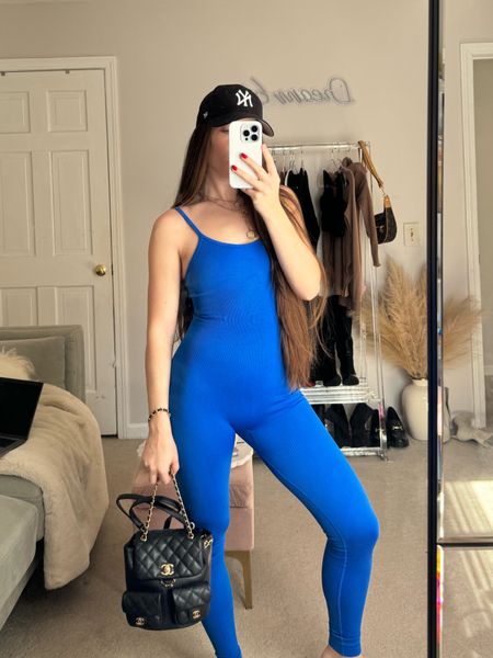 Workout outfit inspo🧿🪬💙 blue jumpsuit from Amazon. Black fitted Yankees baseball hat Amazon. Workout inspiration fit. Evil eye outfit aesthetic. Cc inspired black mini handbag. Running errands casual outfit. Sporty chic

#LTKworkwear #LTKSeasonal #LTKfindsunder50