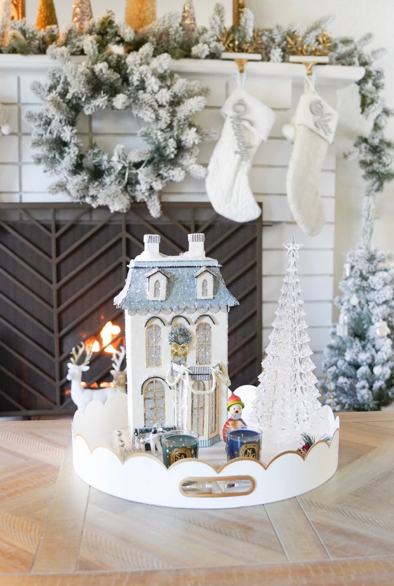 My Christmas Decor: White Scalloped Tray, Christmas House, Flocked Christmas Garland, Diptyque Holiday Candles and White Christmas Stockings. 

#LTKhome #LTKSeasonal #LTKHoliday