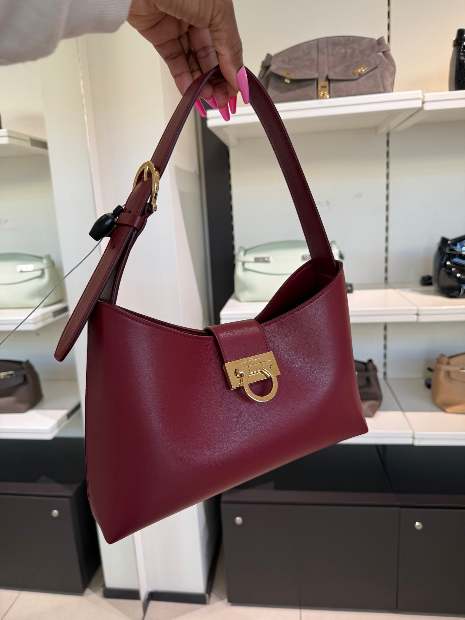 This wine color is also stunning! Such a good price at the outlet. Ferragamo bag, designer bag on sale , Fashion find , red bag, shoulder bag, small bag, versatile bag 

#LTKdayinmylife #LTKSeasonal