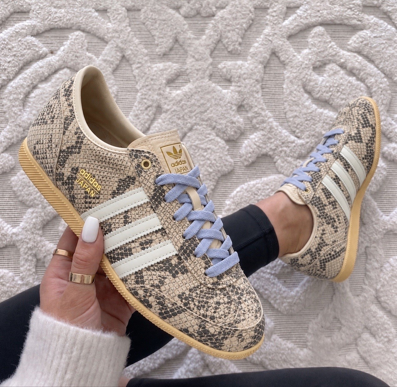 The adidas Japan Low Top Sneaker is the perfect mix of vintage inspired style and everyday comfort, and this snakeskin print with the blue laces makes them such a fun statement piece. 

They fit true to size with a sleek, low profile silhouette that hugs your foot comfortably while still leaving enough room for all day wear.