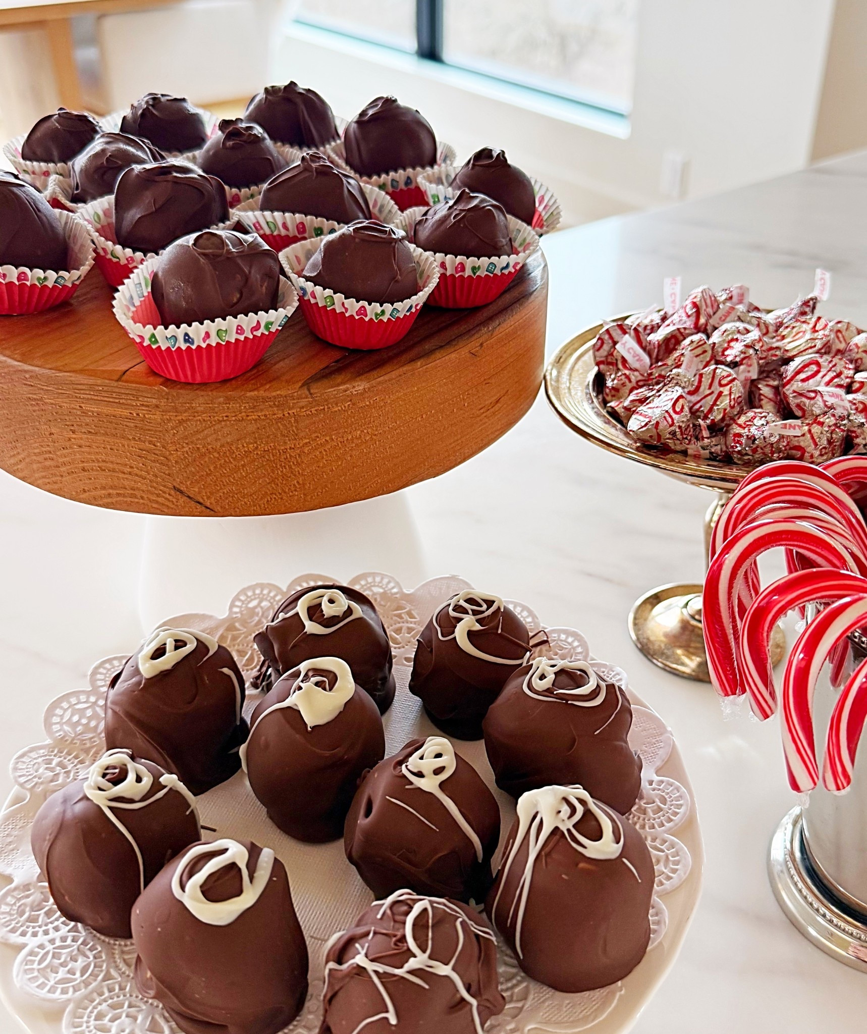 Peanut Butter Bon Bons
By The Preppy Pagoda

1 cup salted butter
2 cups creamy peanut butter 
4 cups powdered sugar 
1.5 cups crushed graham crackers crumbs
1 large bag milk chocolate chips 

Roll out graham crackers until finely crushed. In a saucepan, melt butter and peanut butter over low heat until melted. Remove from heat and add powdered sugar and graham cracker crumbs. Roll into small balls and chill. Melt chocolate chips slowly on low heat in a double boiler. Once balls have chilled, dip into melted milk chocolate. 
After chocolate is set, Enjoy and share! 

It’s a holiday favorite! 