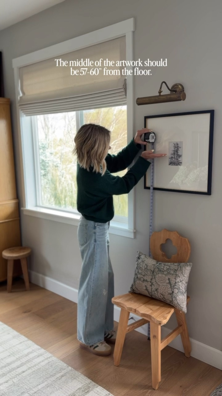 When it comes to hanging art, most people hang it too high, which results in the room feeling disconnected! A great rule of thumb is to hang your art so the center of the piece is 57”-60” from the floor. This keeps your art or frames feeling anchored to the space and any furniture pieces below! 

#LTKHome