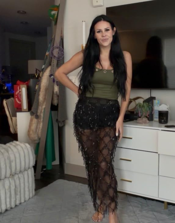 Sparkle and shimmy. This festival-ready look features a shimmering black sequin fringe maxi skirt over matching shorts, paired with an olive green ribbed tank top for a touch of utility chic. #FestivalFashion #SequinSkirt #LTKparty 

 #LTKSpringSale #LTKdayinmylife #LTKootd