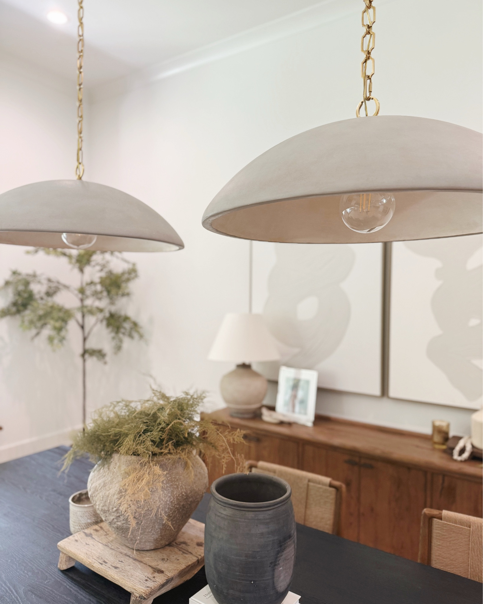 Visual Comfort concrete ceramic natural pendants over dining table! These would look amazing over a kitchen island as well ✨

#LTKStyleTip #LTKHome