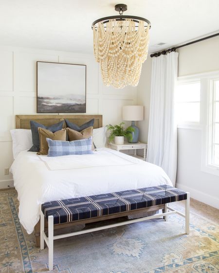 Love the warm and cozy vibes of our previous guest room. Items include the affordable Studio McGee abstract art from Target, a wood & cane bed frame, blue plaid pillow, brown velvet pillows, bluish gray linen pillows and white duvet with tan stripes. The white spindle nightstand includes a blue-gray ceramic lamp and faux greenery in a white pot.

Target finds, master bedroom, guest bedroom, home, williams sonoma, bedroom bench, bedroom bedding, pottery barn bedroom, pottery barn bedding, serena & lily, bedroom inspiration, pottery barn bed, pottery barn lights, abstract wall art, art for home, target art, studio mcgee Target, target threshold #ltkseasonal #Ltkfamily #ltkunder50 #ltkstyletip #ltkfind 

#LTKunder100 #LTKhome #LTKsalealert #LTKhome #LTKSeasonal #LTKstyletip