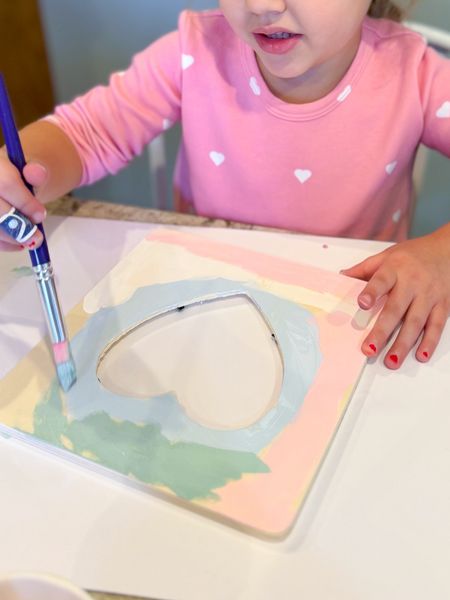 $1.12 paintable heart photo frame - such a fun Valentine’s Day craft for kids! Millie had a few friends over today for a play date and they loved painting these wooden frames with pink, green, and blue acrylic paint. Also linking the DIY Princess wands they decorated. Would make a great class valentines gift! 

Mom hack, kids arts and crafts, kids activities, painting, Amazon find 

#LTKfindsunder50 #LTKkids #LTKSeasonal