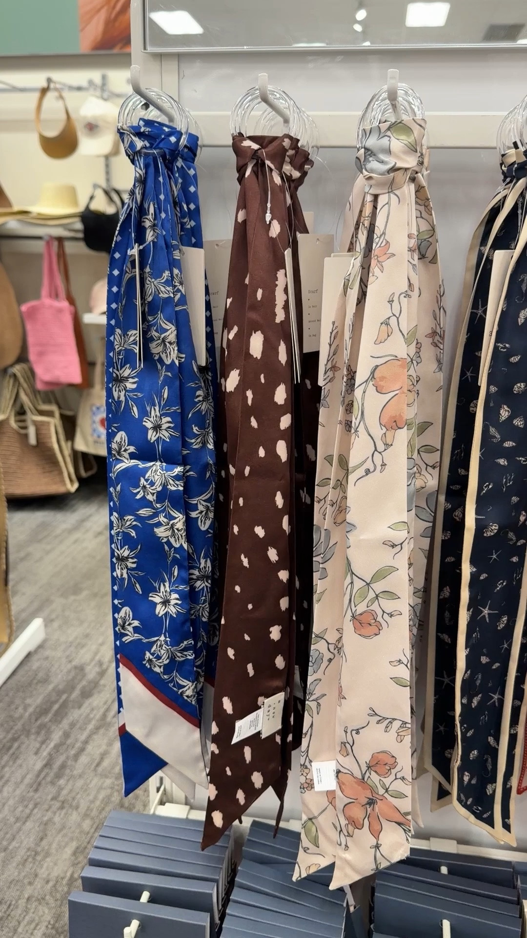 Skinny scarves at Target, perfect for tying onto your purse or hand bag.  Fun way to accessorize for the summer

#LTKmomlife