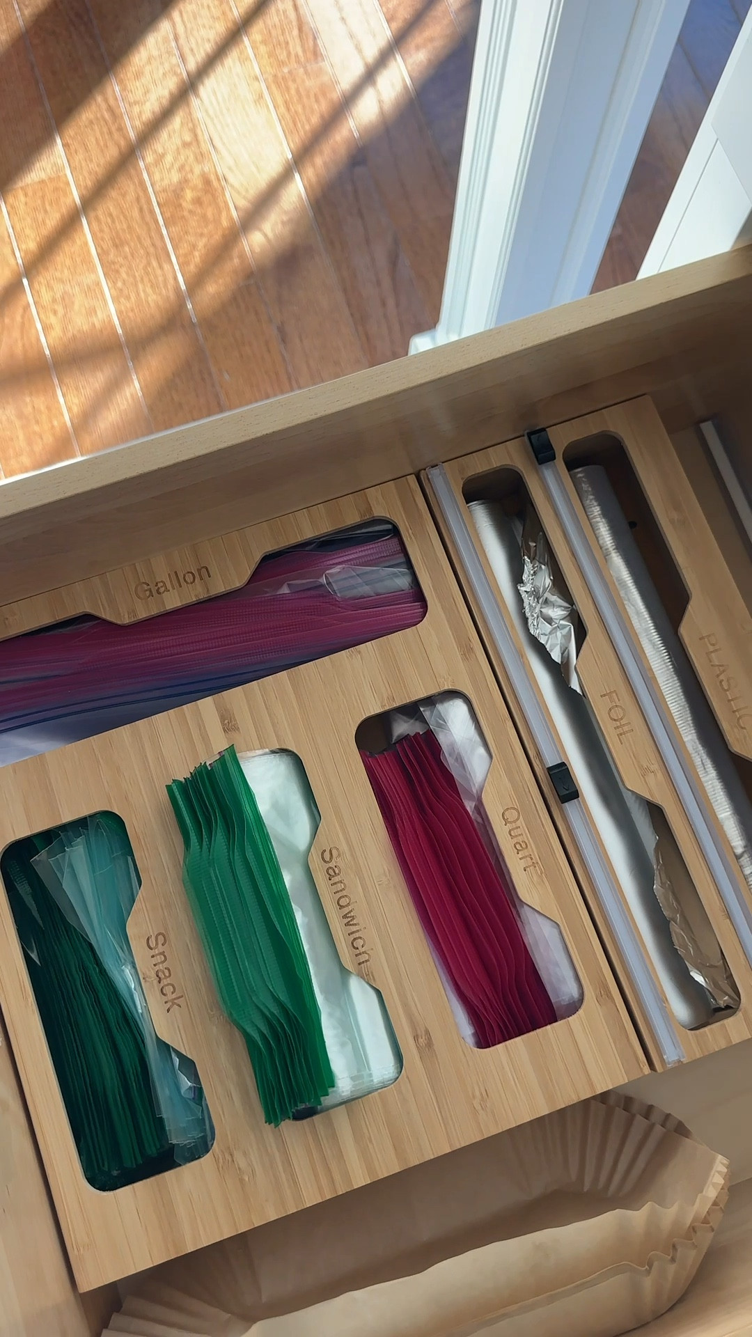 You know that one drawer that becomes a black hole of Ziplocs & foil? This organizer totally fixed mine!
Fits gallon, quart, sandwich & snack bags + a built-in foil & plastic wrap dispenser. So sleek in the drawer! 
A perfect little upgrade for any kitchen refresh & so satisfying every time you open the drawer !!!!
Follow for more home organization finds 🏠✨

Bamboo kitchen organizer, storage bag organizer, bamboo foil dispenser, kitchen drawer organization, modern kitchen home, aesthetic organization, clutter free home, Amazon kitchen favorite, organizing, Black Friday, Cyber Monday

#LTKCyberWeek #LTKHoliday #LTKHome