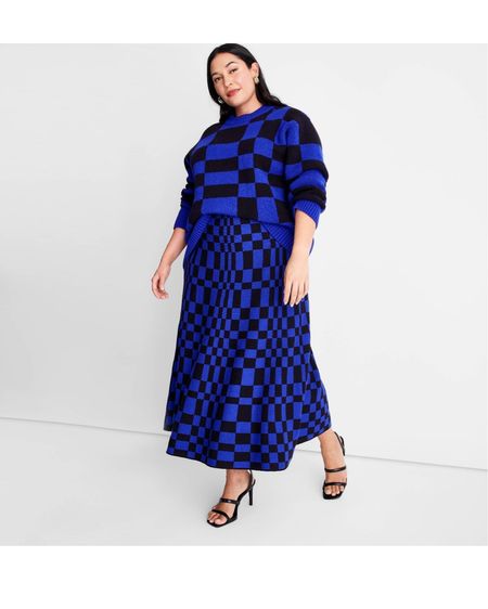 Crewneck slouchy pullover sweater
Blue-and-black geometric pattern
Below-waist length with long sleeves and ribbed cuffs

Sweater midi skirt
Allover black-and-blue checkered print
High-rise with full elastic waistband


#LTKcurves #LTKSeasonal #LTKunder50