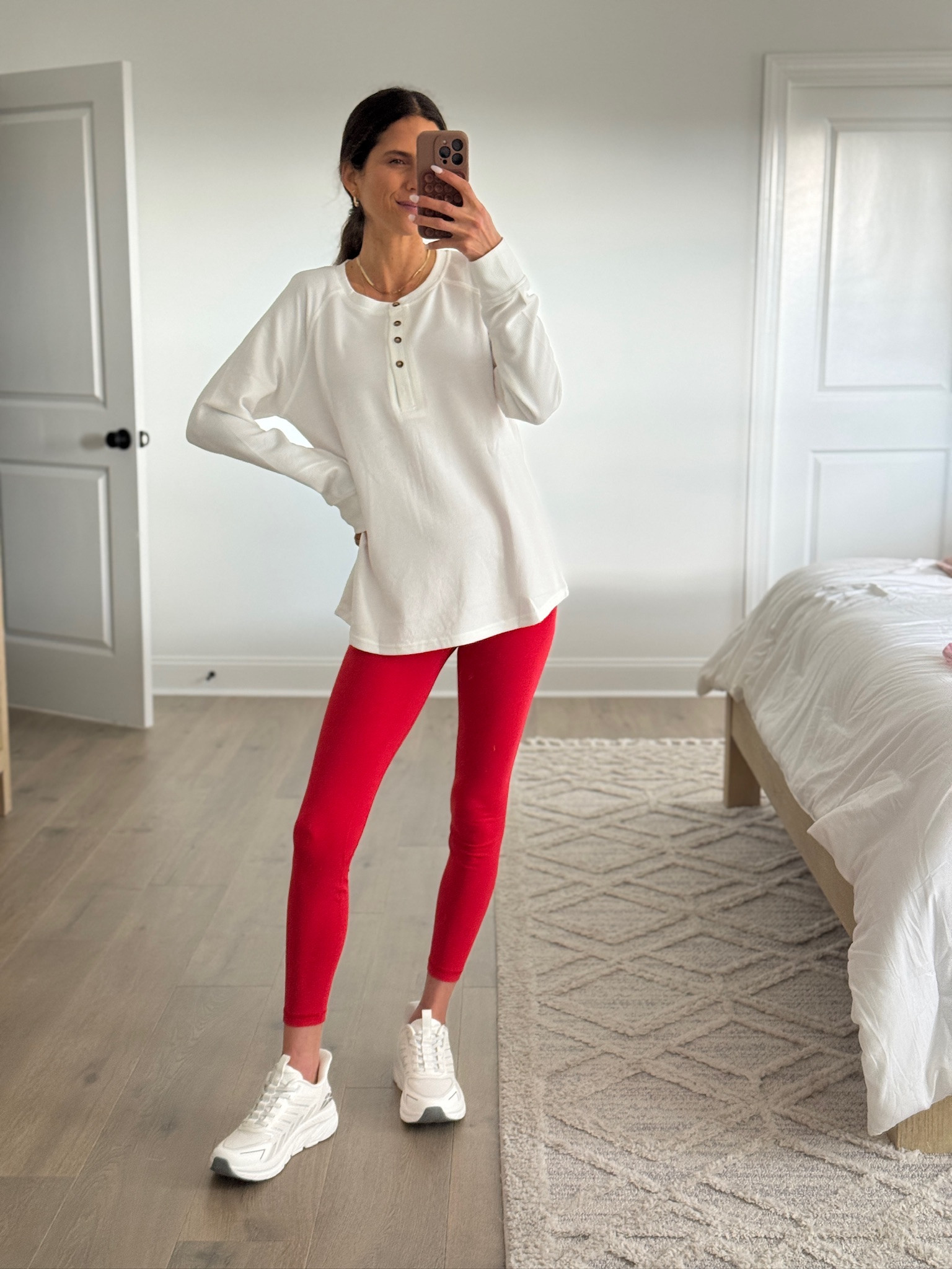 Classic white henley styled with red leggings and sneakers for an easy, everyday casual outfit. Soft, lightweight top with a relaxed fit that works for layering or wearing on its own. Perfect for athleisure wear, school drop off, running errands, travel days, or casual weekends. White henley top, leggings outfit, casual athleisure style, everyday mom outfit, comfortable casual wear, relaxed fit top, spring casual outfit, simple everyday style.

#LTKFindsUnder50 #LTKSeasonal #LTKootd