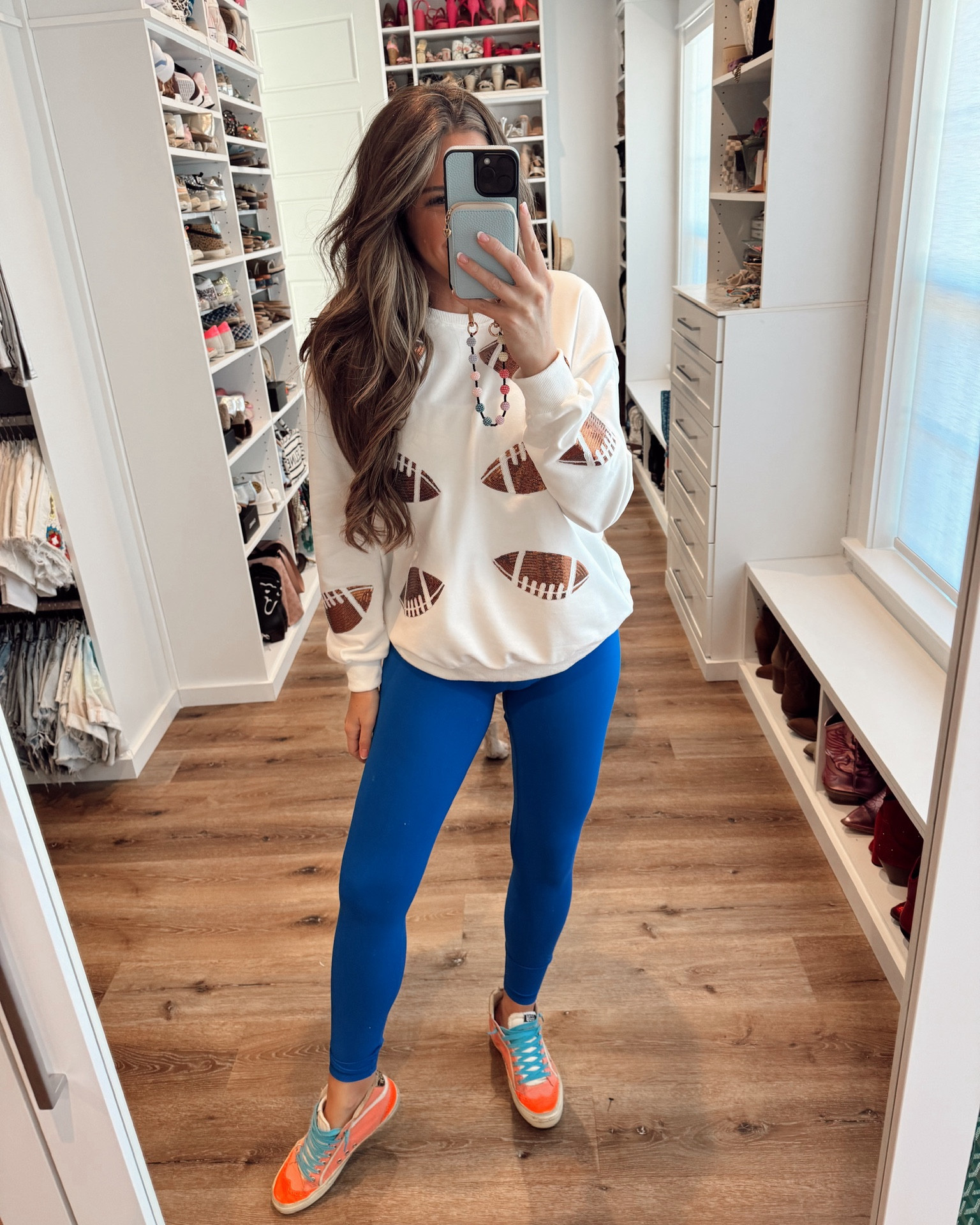 In a medium sequin football sweatshirt, small leggings, sneakers and accessories - all fits tts.

#LTKSeasonal #LTKStyleTip #LTKFindsUnder50