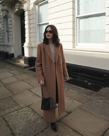 camel wool blend coat, striped top, leather pants, sunglasses, black bag, gold hoops, chain necklace, gold jewellery, heeled boots, whistles, frankie shop, le specs, net a porter, selfridges, by far, coggles, astrid & miyu, monica vinader, daisy jewellery, manu atelier, luisaviaroma, agolde, abercrombie and fitch, h&m, arket 

Black Friday/Cyber Week discounts:
wool blend coat: whistles 20% off 
wool blend coat: abercrombie & fitch 25% off
by far black boots: (via coggles) 25% off
gold hoops: astrid & miyu 25% off
gold bracelet: monica vinader 30% off 
chain necklace: daisy jewellery 20% off 



#LTKCyberSaleUK #LTKeurope #LTKstyletip