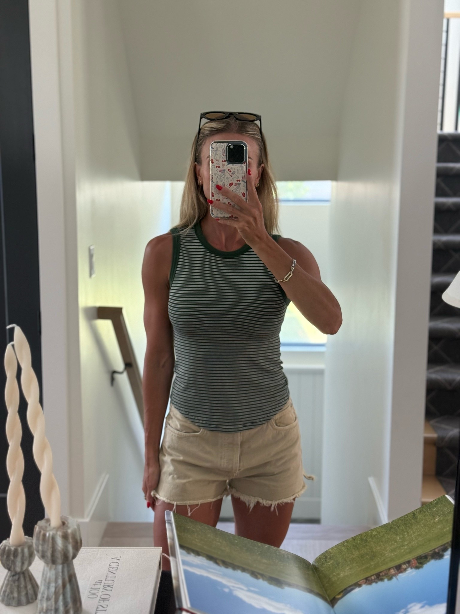 Wearing a 6 in this top. The material is so soft and stretchy. Already ordered the solid grey! Perfect summer piece. You could definitely size down Id wanting a more fitted look on the waist. 

Got these shorts last summer. They run big I could have sized down one