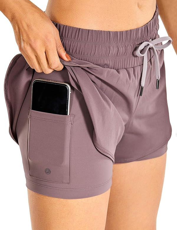 CRZ YOGA Workout Running Shorts Women with Liner 2 in 1 Athletic Sports Shorts with Zip Pocket- 3... | Amazon (US)