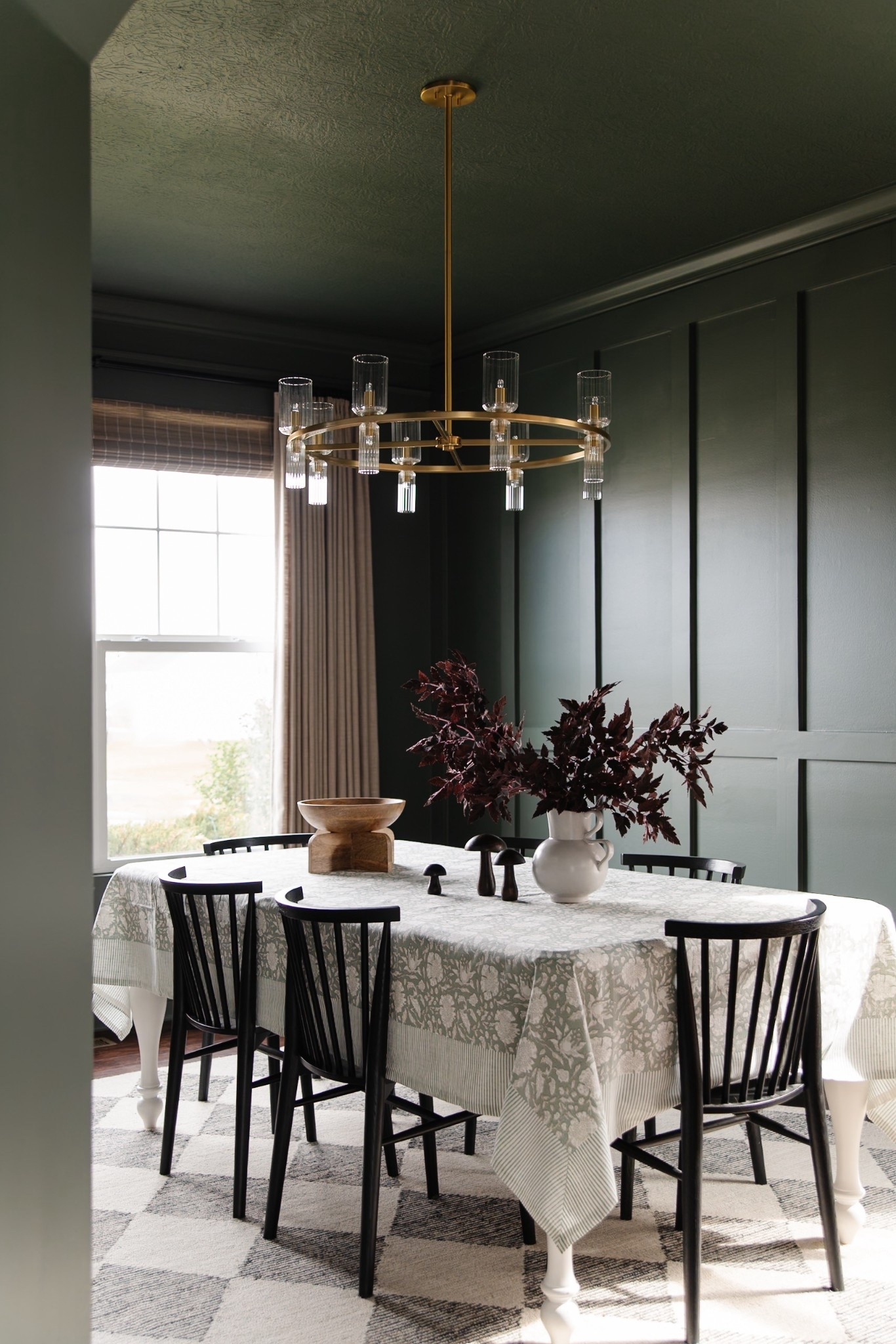 Moody dining room decor for fall 🍂 Amazon curtains, green walls, antique brass chandelier, black dining chairs, block print tableclothh

#LTKSeasonal #LTKHome #LTKStyleTip