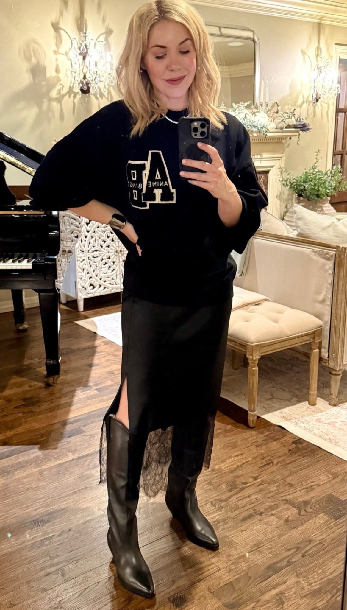 Anine Bing sweatshirt 
Lace skirt
Western boots 

#LTKSeasonal #LTKFindsUnder50