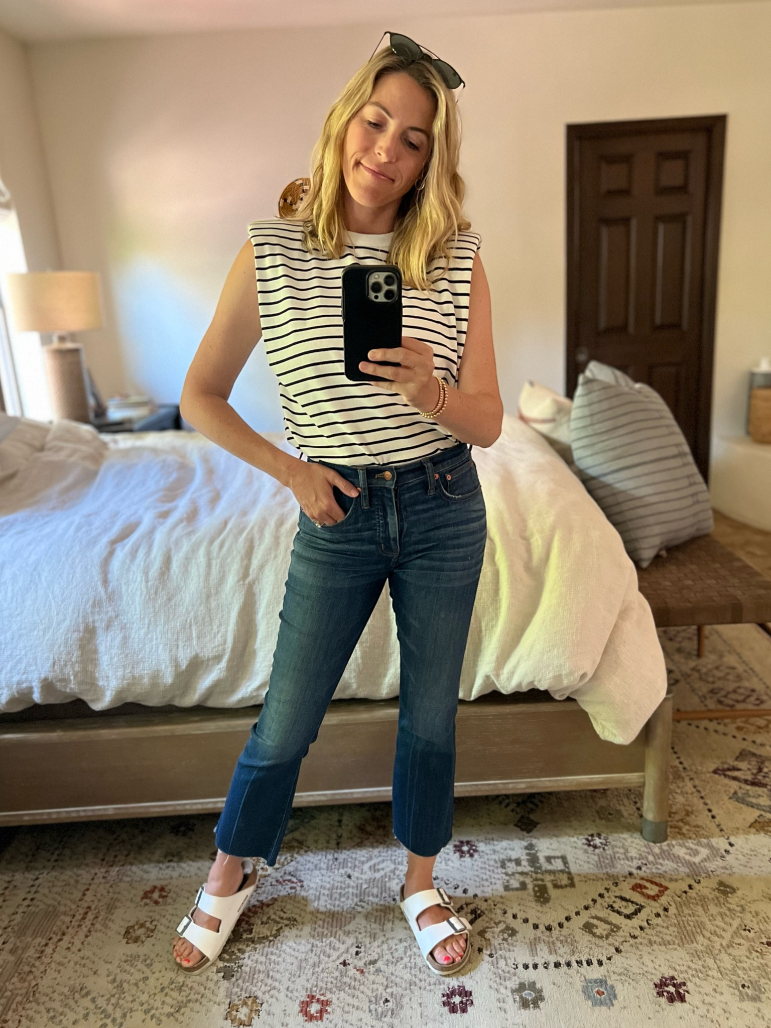 OOTD: striped shoulder pad tee - this is such a good transition piece into Fall! Work with kick flare cropped jeans, white birks. Everything TTS. Laura in a small and a 26. 

#LTKBacktoSchool #LTKstyletip #LTKFind