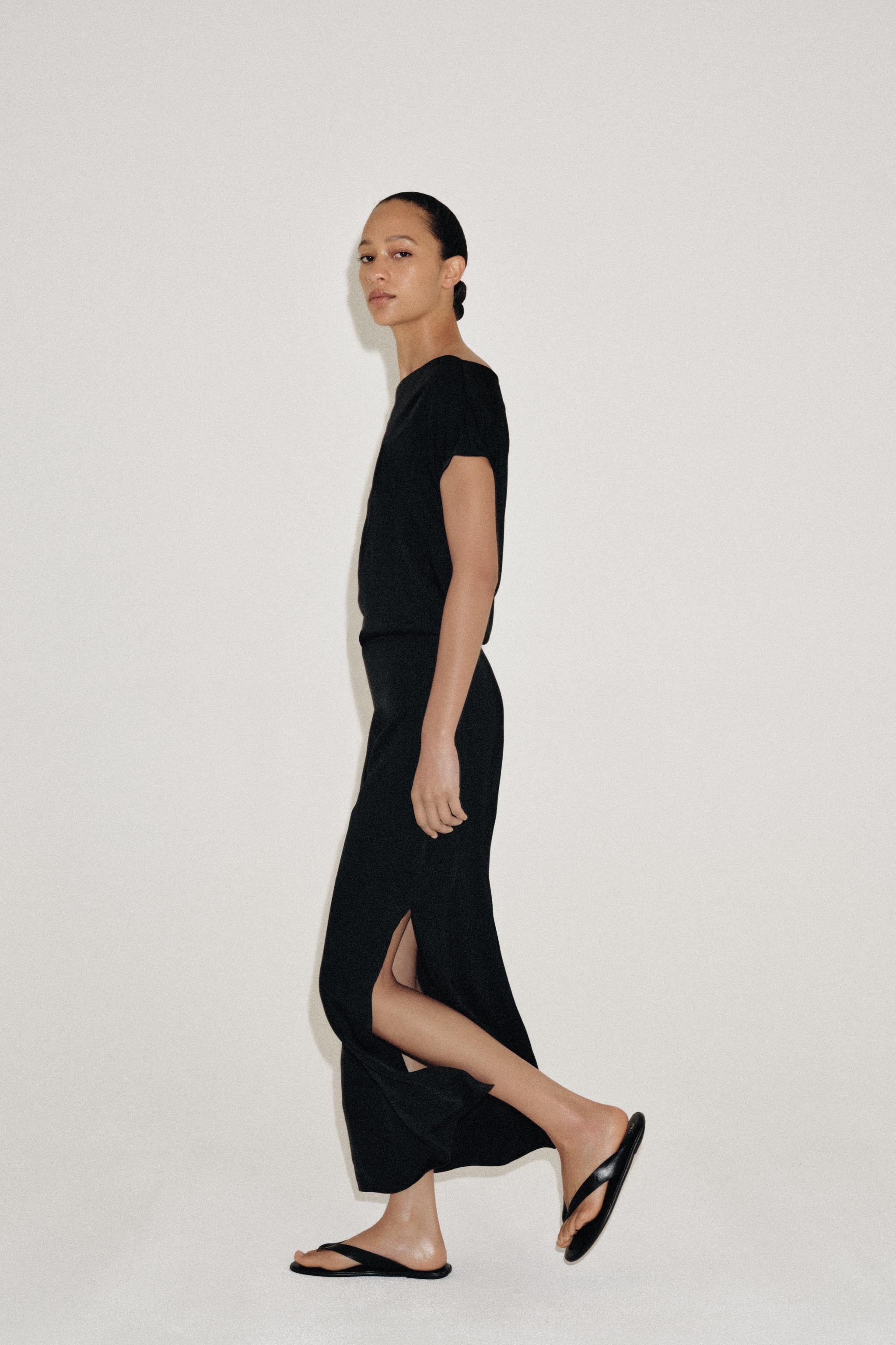 ZARA WOMAN COLLECTION. Dress made with a viscose blend. Features a flowing neckline and sleeveles... | Zara US