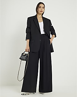 Black Pleated Wide Leg Trousers | River Island UK & IE