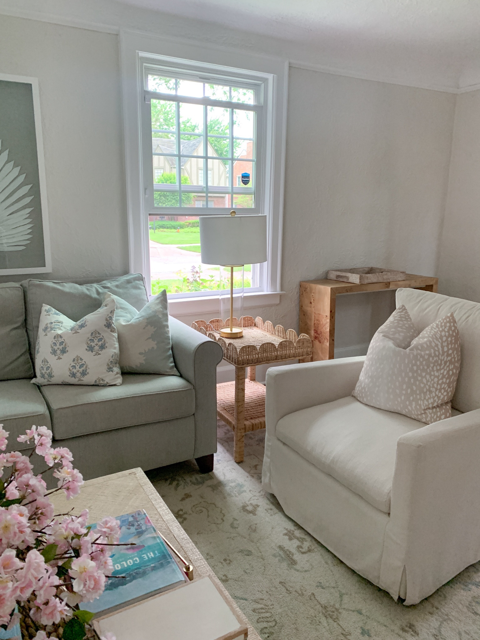 Scallop rattan side table in our living roomm

#LTKFindsUnder100 #LTKHome