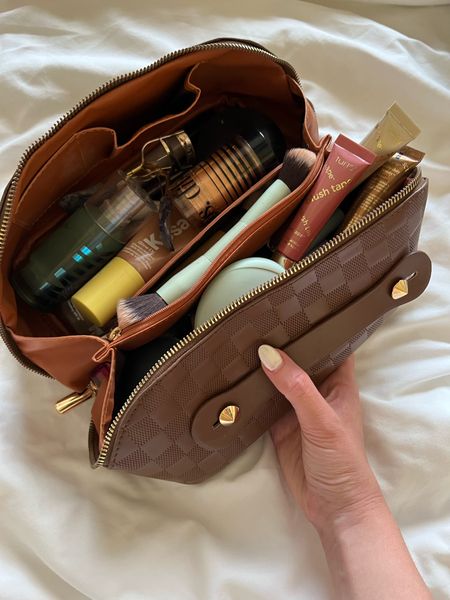 This travel makeup bag holds a ton! It opens to two compartments with a middle pocket 

#LTKtravel #LTKbeauty