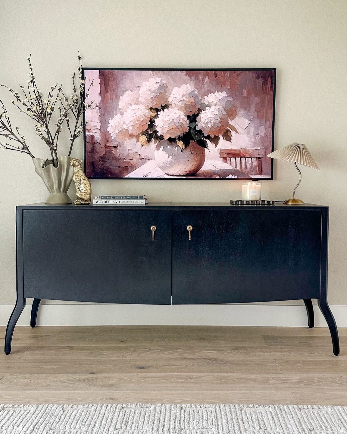 Media console styling 🖤 This is a 55” Frame TV! And this console is such a great size with lots of storage! Currently 25% off!

#LTKsalealert #LTKstyletip #LTKhome