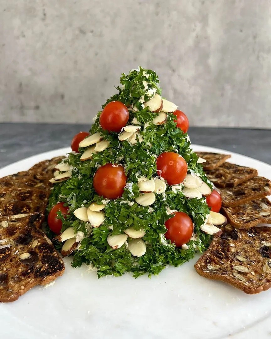 Christmas App Idea 

Ingredients
* 16 oz cream cheese softened
* 6 oz Grand Cru grated
* 1 1-oz packet dry onion soup mix
* 1/3 cup sliced almonds
* 6 cherry tomatoes halved
* 1/2 cup parsley chopped
* Crackers for serving

Instructions 
* In a medium bowl, mix cream cheese and soup mix until fully combined. Add Grand Cru cheese and stir to combine. 
* Using your hands and/or a rubber spatula shape the mixture into a cone, pointy end up. Top with parsley and use plastic wrap to gently press onto the cheese. Refrigerate for at least 2 hours. 
* When ready to serve, let tree stand at room temperature for 15 minutes. Press tomatoes and almonds into the cheese to decorate. before serving. 
* Serve with your favorite crackers and enjoy! 
https://ainttooproudtomeg.com/holiday-christmas-tree-cheese-ball/

#LTKHoliday #LTKSeasonal #LTKHome