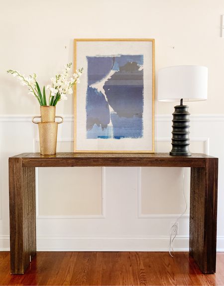 This simple console table is the perfect piece to style with Holiday decor!
.
.
.
Parsons Console Table 
Natural Wood
Bronze Lamp
Hammered Gold Vase
Faux Floral Stems
Navy Blue Artwork 
Sleek
Elegant 

#LTKstyletip #LTKhome #LTKHoliday