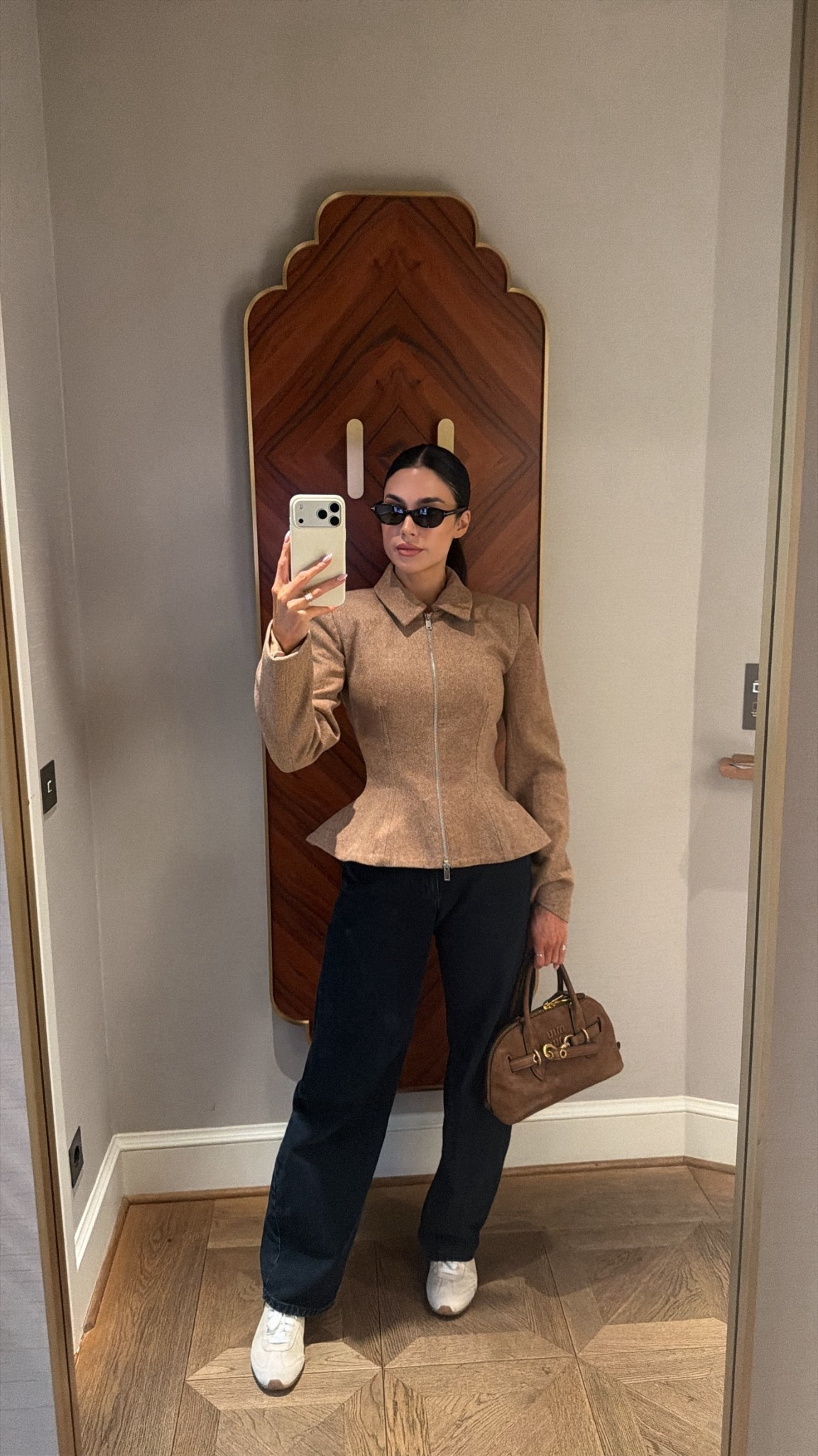Wearing size xs in the jacket, size 2 in the jeans 