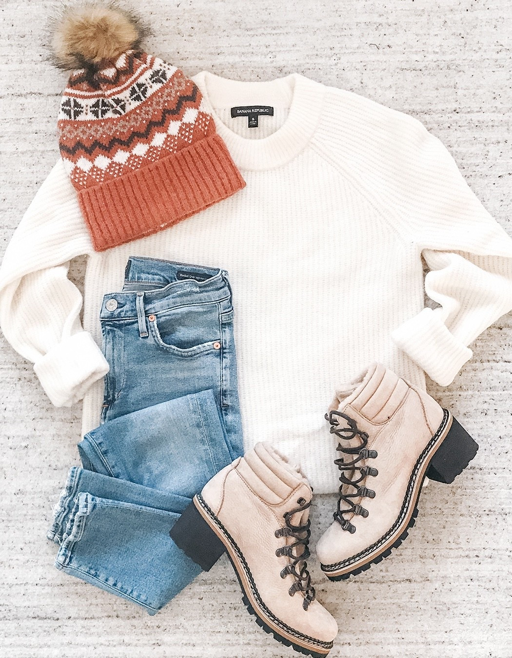 Winter weather cold outfit pom pom fair isle beanie knit hat with off white ribbed crewneck white sweater and light wash jeans and winter hiking boots #over40style #dailystylefinds #winteroutfit #wintersweaters #wintervacation

#LTKOver40 #LTKFindsUnder50 #LTKootd
