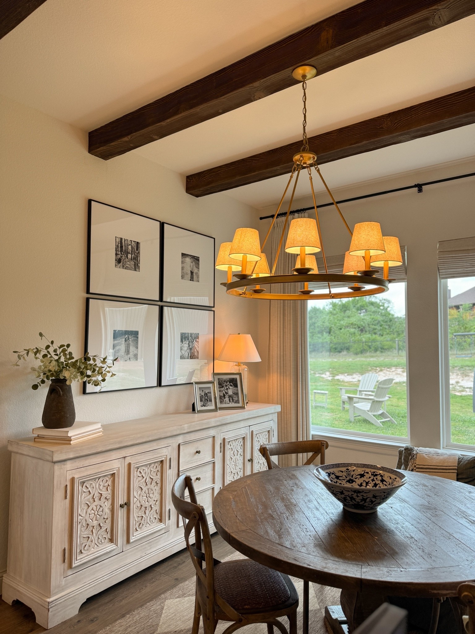 Cozy dining nook, curtains, curtain rod, picture frame, table, dining chairs, rug, sideboard, wool faux beams, lamp, chandelier

#LTKHome #LTKmomlife #LTKdayinmylife