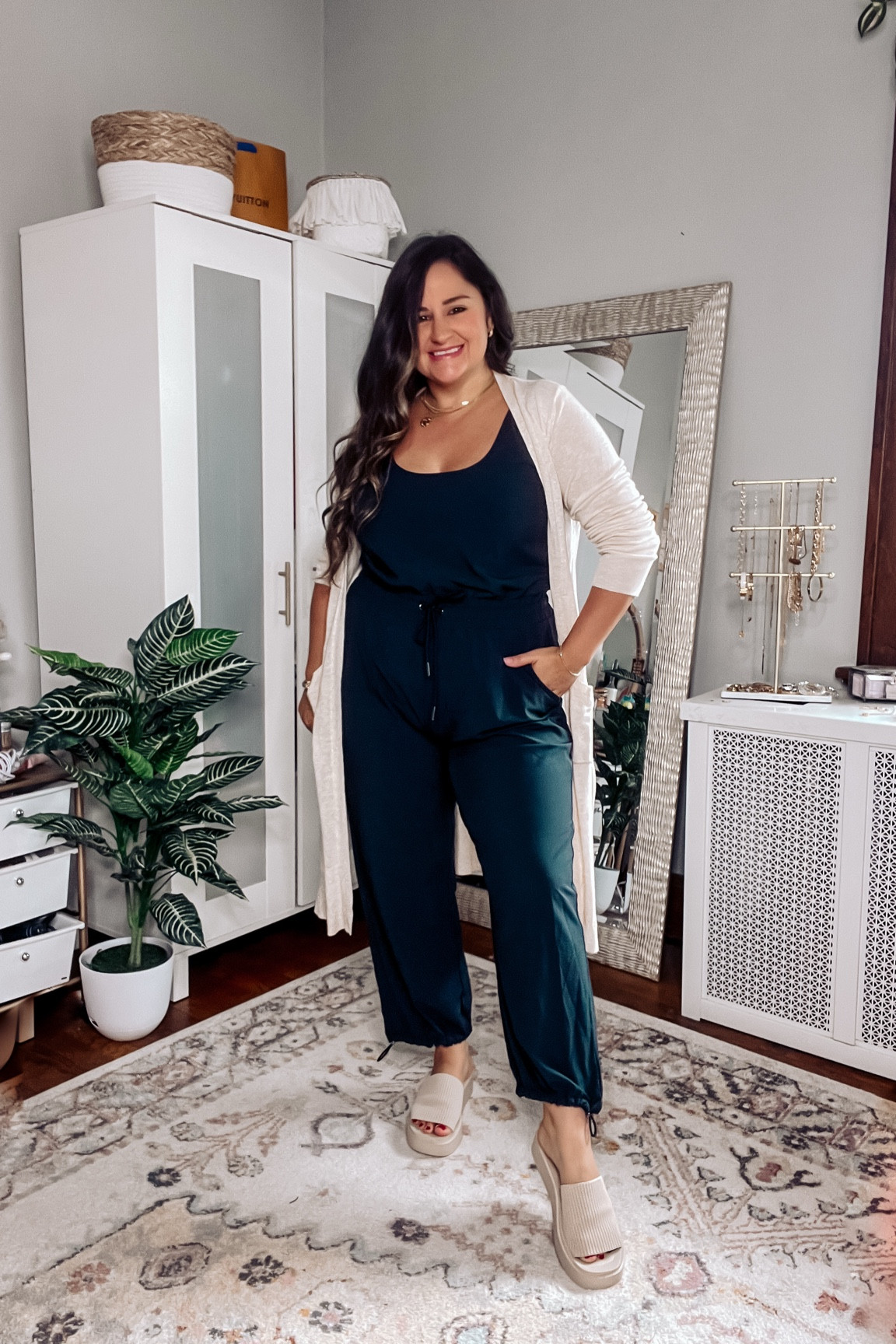 A comfortable travel outfit you’ll wear on repeat!

Wearing a size large petite in this black jumpsuit, paired with a beige duster cardigan, and platform slides! Also linked my favorite travel bags! 

Midsize, curvy, luggage, suitcase, romper, size 14, Abercrombie, casual outfit, travel style 

#LTKTravel #LTKMidsize #LTKFindsUnder100