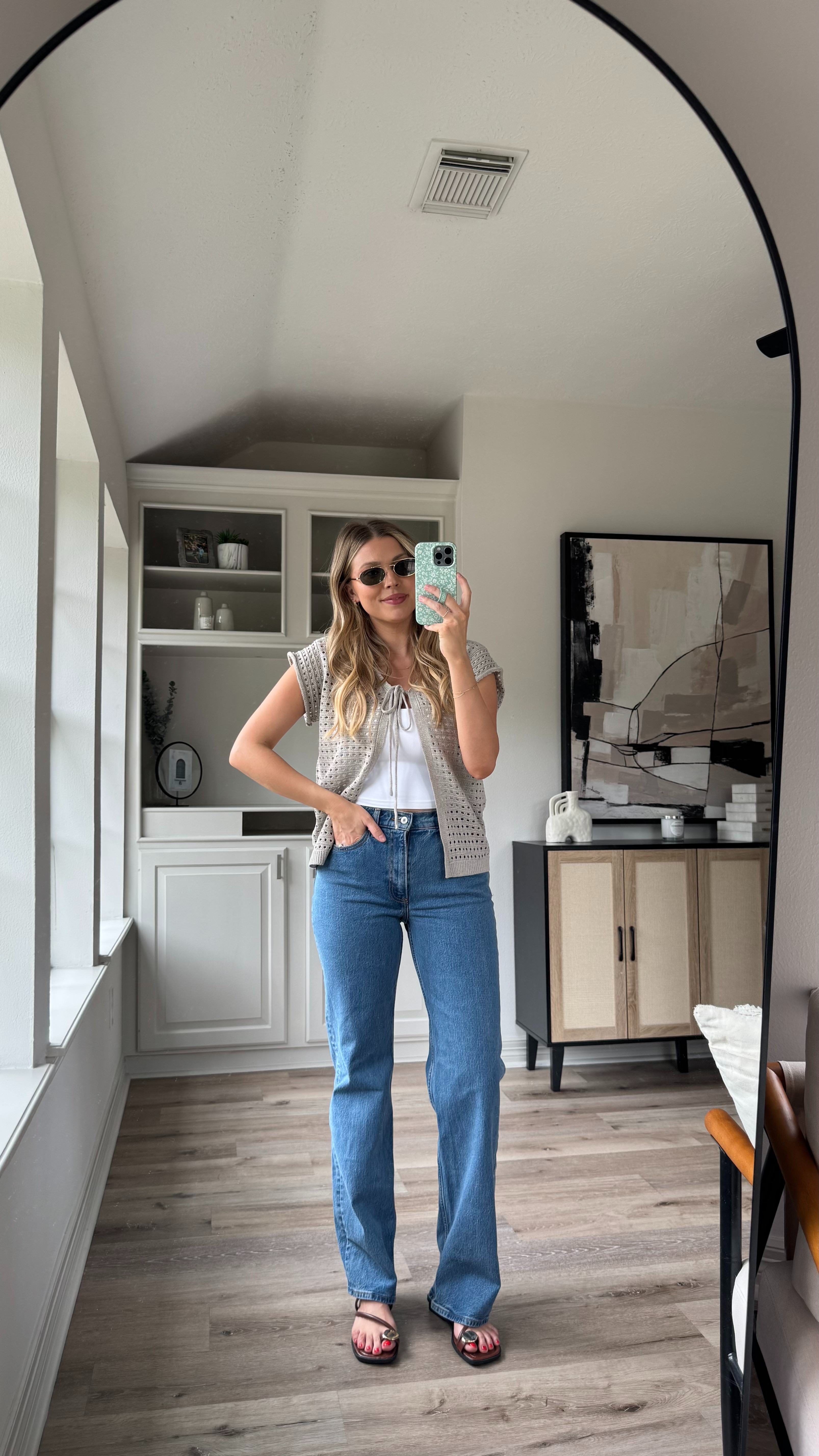 Casual Summer Outfit | This crochet top is so cute with jeans or as a coverup top. Wearing size M in the top and sports bra top.  size 27 in the jeans. Sandals fit tts.  

 

#LTKStyleTip