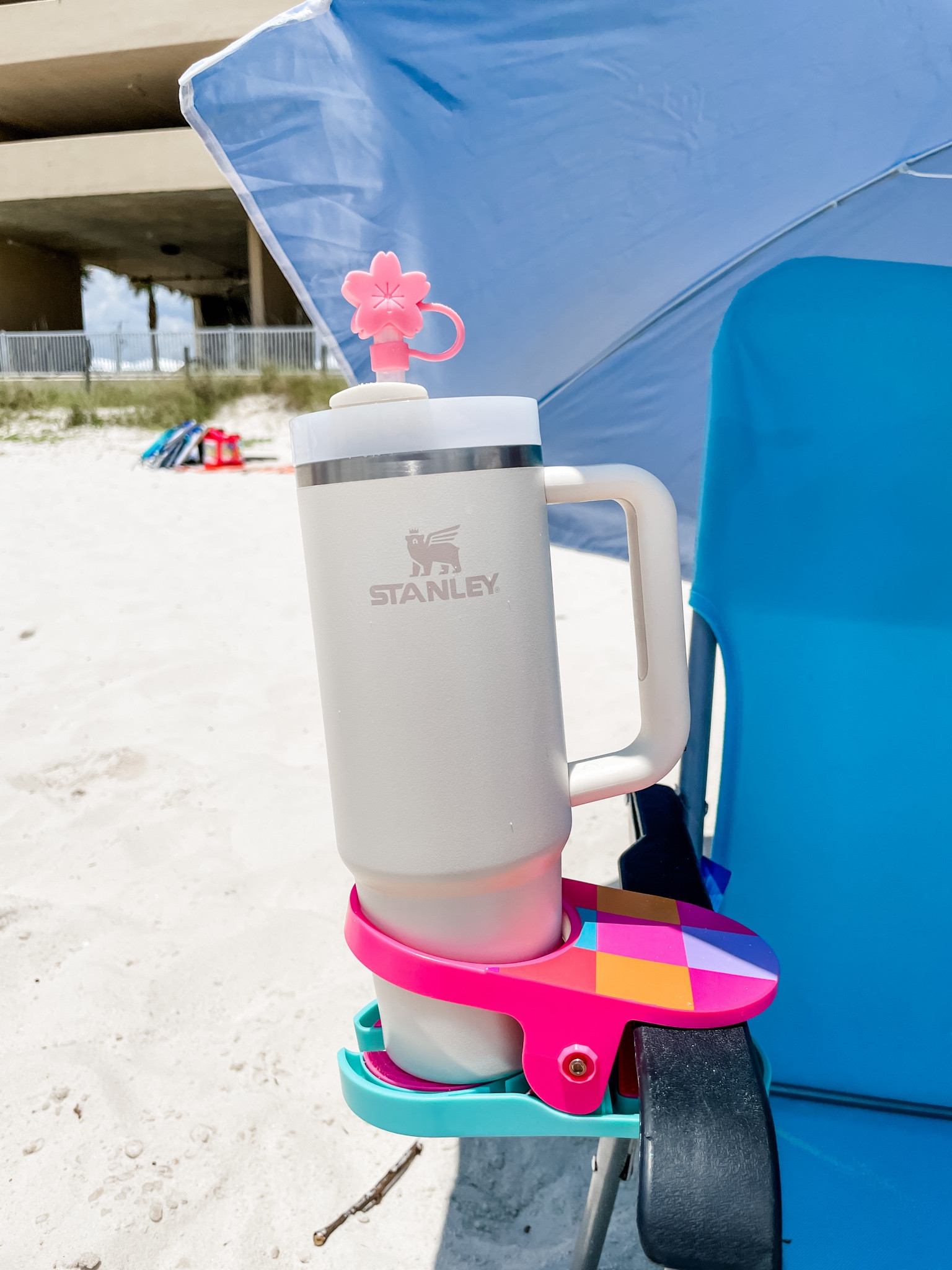 2 Summer “beach” must haves:
1. Cup holder clips 
It’s so convenient to have, it clips right on your lounge chair.  
2. Silicone straw cover 
To keep sand and bugs out of your drink  

#LTKFind #LTKswim #LTKSeasonal