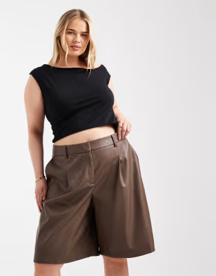 ASOS DESIGN Curve leather look longline pleat front safari shorts in brown | ASOS (Global)