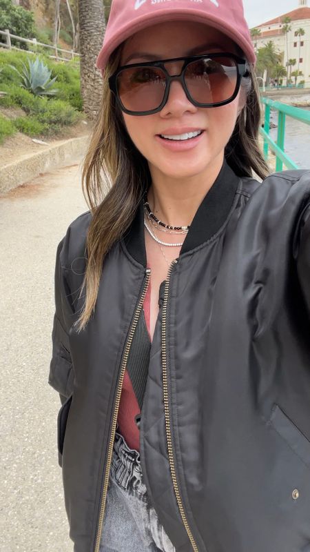 What I wore to Catalina Island ⛴️ It was a chilly spring day sightseeing. My black bomber jacket is back in stock! It’s SO good and can be worn year round. An investment but price per wear ladies! I’ve worn her countless times. My belt bag looks similar to the Lululemon one but for a fraction of the price. My sneakers are currently on sale! My popular sunglasses are on sale 2 for 1! 

Spring outfit, vacation outfit, bomber jacket, belt bag, fanny bag, sunglasses, jeans, Adidas sneakers, baseball cap, sale, The Stylizt 



#LTKSeasonal #LTKStyleTip #LTKTravel