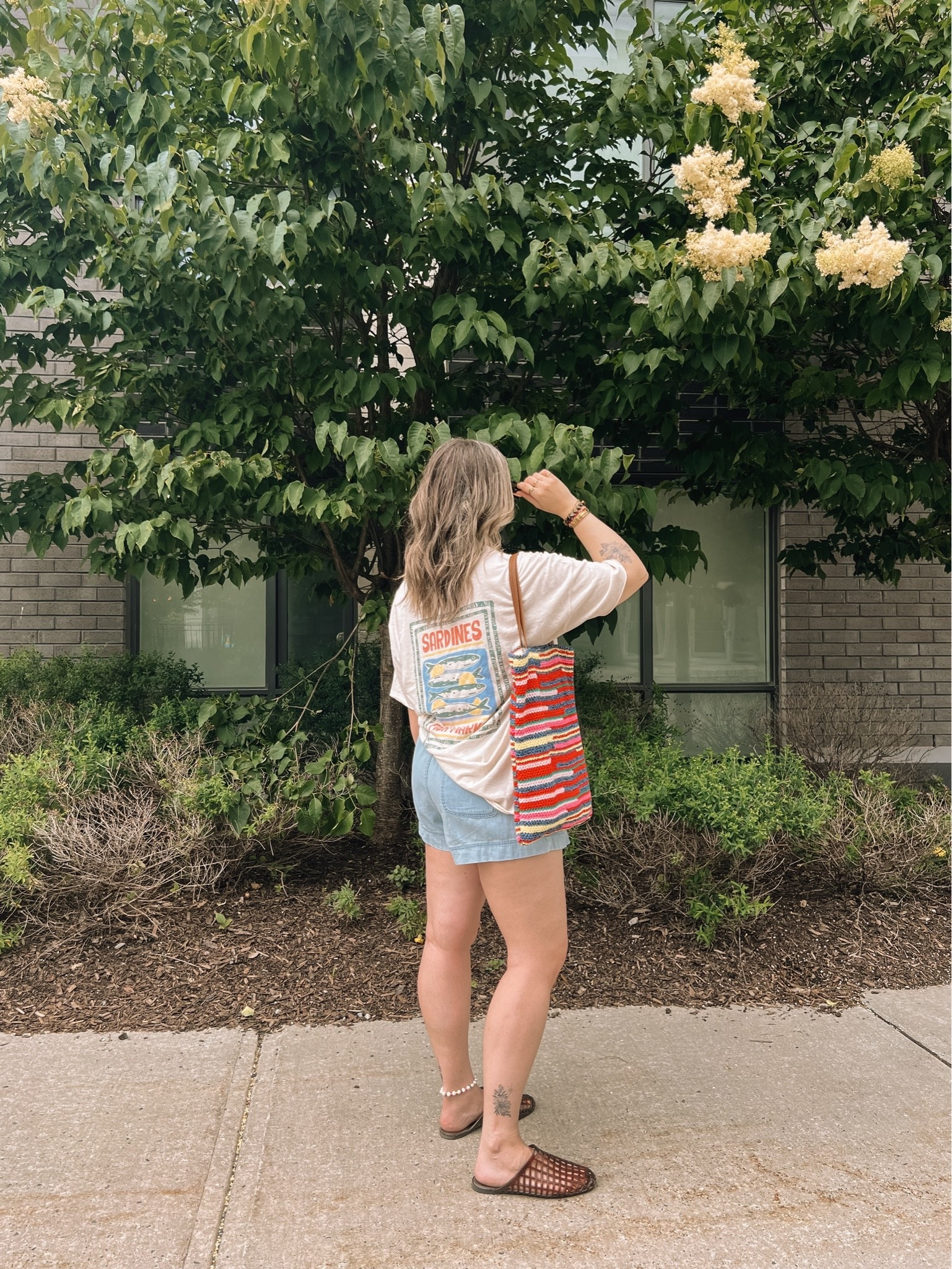 Comfy summer ootd! Wearing my usual size L in the graphic tee and shorts. I’m a 9.5-10 shoe and wear a 10 in the jelly shoes. Canadian shoes and bag links under “similar products”

#LTKsummer #LTKmidsize #LTKstyletip