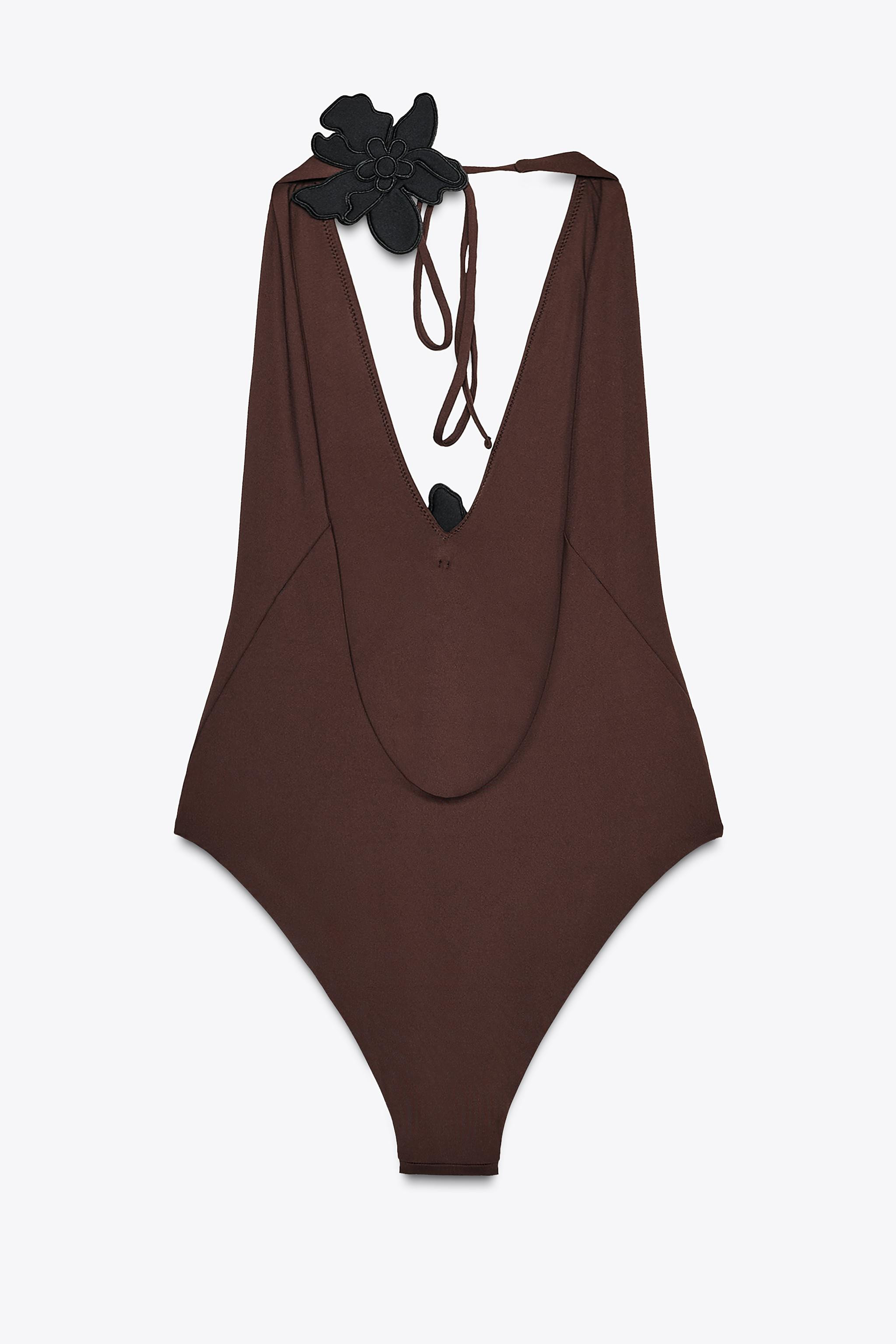 Halter swimsuit with plunging v-neck and open shoulders. Contrasting flower appliqué detail at n... | Zara US