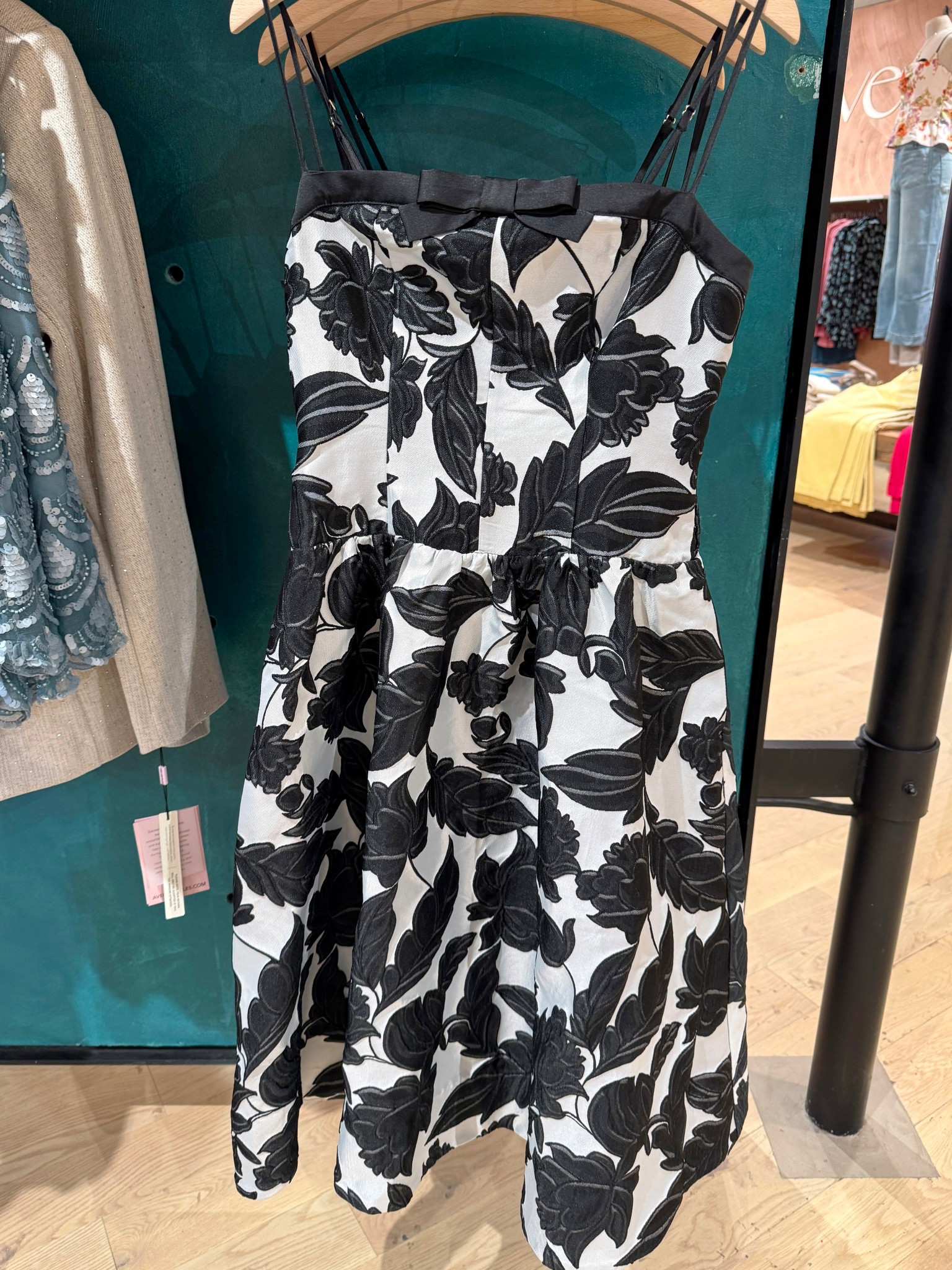 Bold and classy! 🤍🖤 This black-and-white jacquard dress makes a statement without feeling overdone. The rich, textured pattern gives it a luxe, high-quality feel, while the clean silhouette, drop-waist design, and delicate spaghetti straps keep it refined and polished. ✨It’s the kind of piece that stands out in a sophisticated way—perfect for dressy social events, weddings, cocktail parties, or evening celebrations where you want something elevated yet timeless. 🥂 Linked this look along with other chic evening dresses for similar standout styles! #Anthropologie  #MidiDress #EveningDress

#LTKHoliday #LTKPetite #LTKWedding