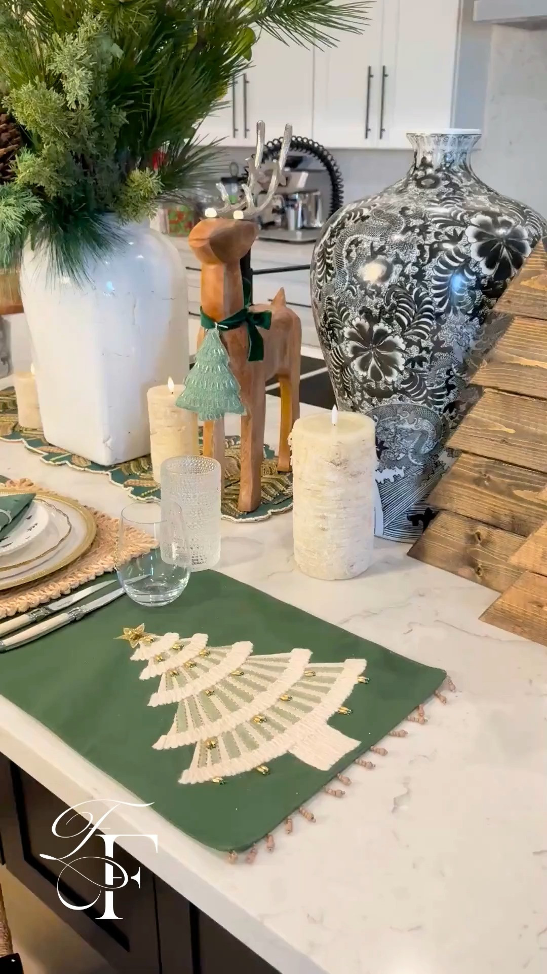 Christmas Table Ideas🎄 I arranged this Christmas tablescape on my kitchen island for a party idea or just a family dinner. I love mixing in the centerpiece of faux greenery to match the wooden reindeer. Most of these finds were from World Market and they were selling fast🔥 

 #LTKHoliday #LTKSeasonal #LTKHome