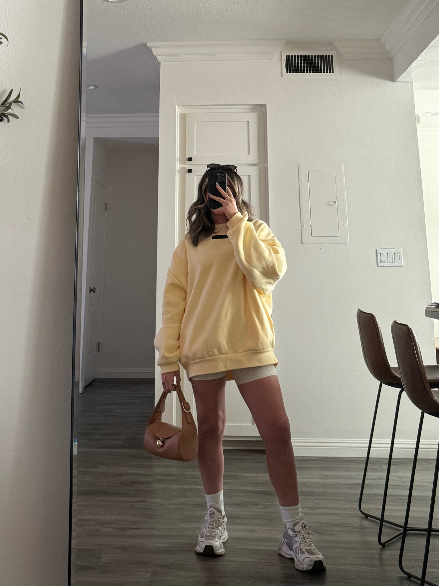 obsessed with this yellow sweater 💛 
— Pacsun sweater, biker shorts, brown bag 