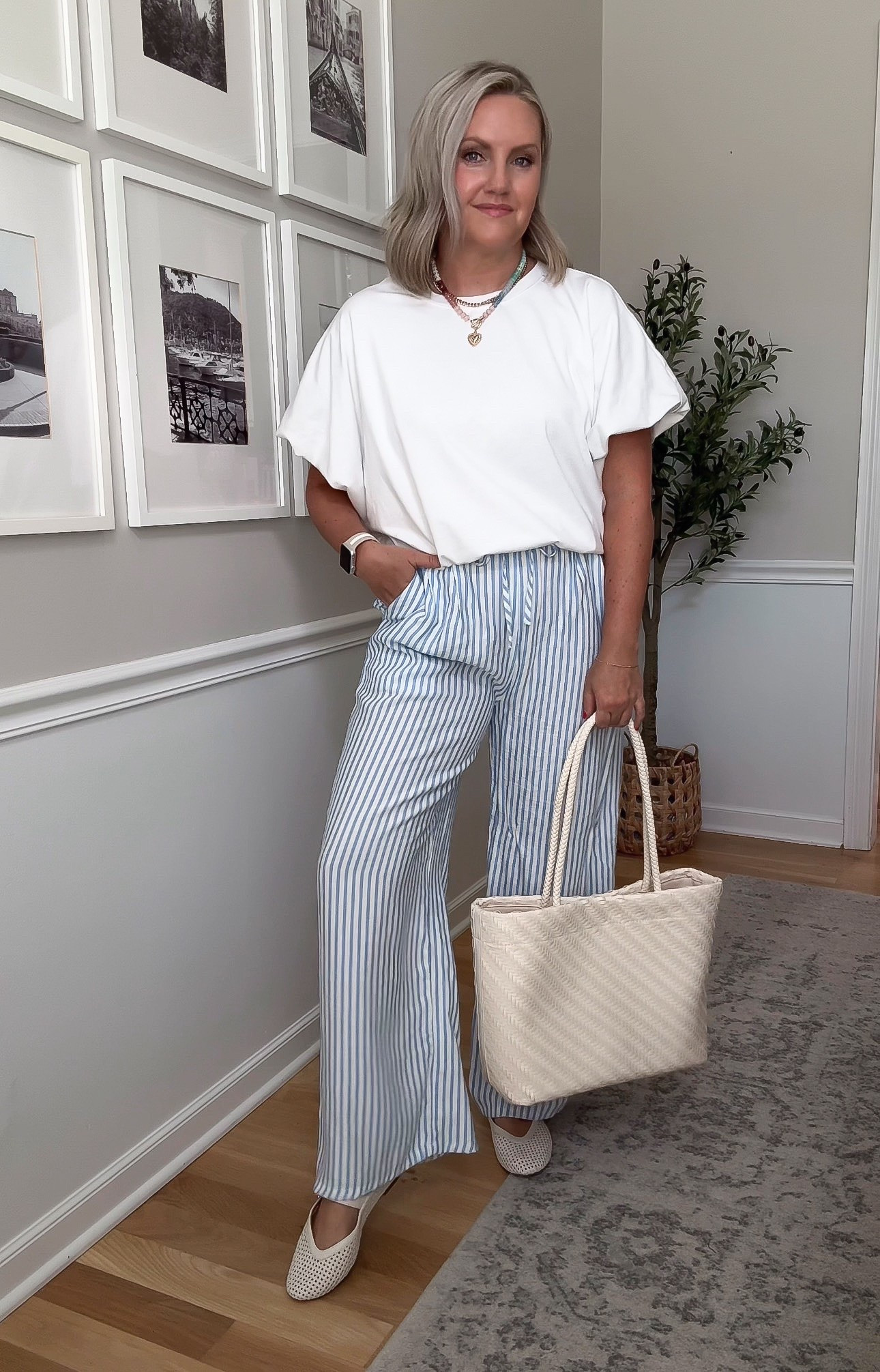 These striped wide leg pants are exactly what I want when it’s still hot but I’m ready to move past shorts. The drawstring waist keeps them comfortable, and I love them with a simple white tee and woven accessories for an easy end of summer outfit.

striped pants, wide leg pants, white tee, summer outfit, casual outfit, drawstring pants, lightweight pants, transitional style, everyday fashion, lovelylifestyling

#LTKootd #LTKOver40 #LTKTravel