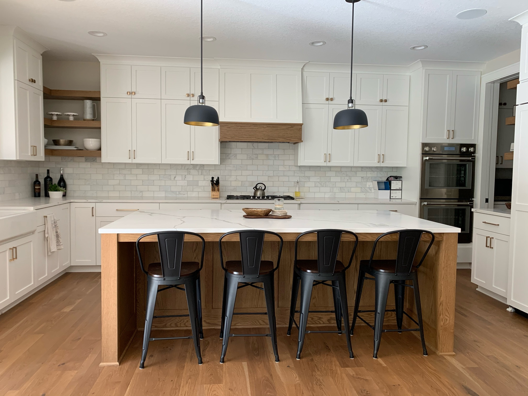Kitchen hardware, pendants and barstools! Loving the satin brass and matte black combo!  New construction bright and light kitchen.  The stools are super kid friendly and affordable! Easy to clean! 

#LTKhome