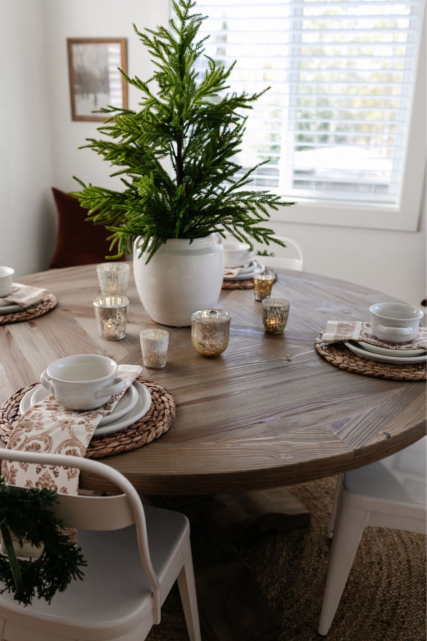 A Christmas centerpiece idea for a round table- a tabletop tree inside an oversized pot or vase. 
Christmas decor 
Holiday decor 
Christmas dining table
Round farmhouse tablee

#LTKhome #LTKsalealert

#LTKHoliday