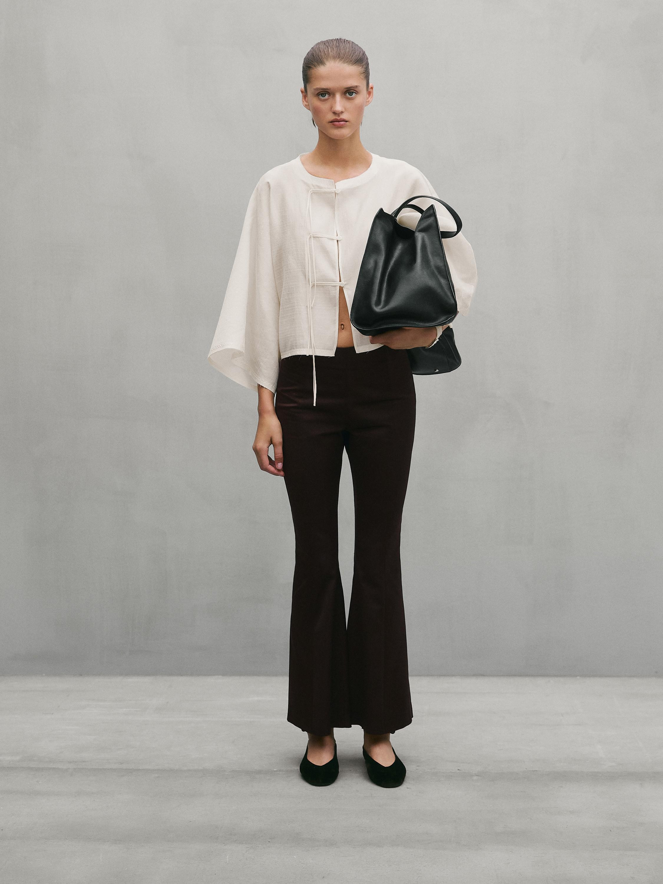 Flowing shirt with semi-sheer fabric . Stand-up collar. Wide long sleeve. Button fastening with l... | Massimo Dutti UK